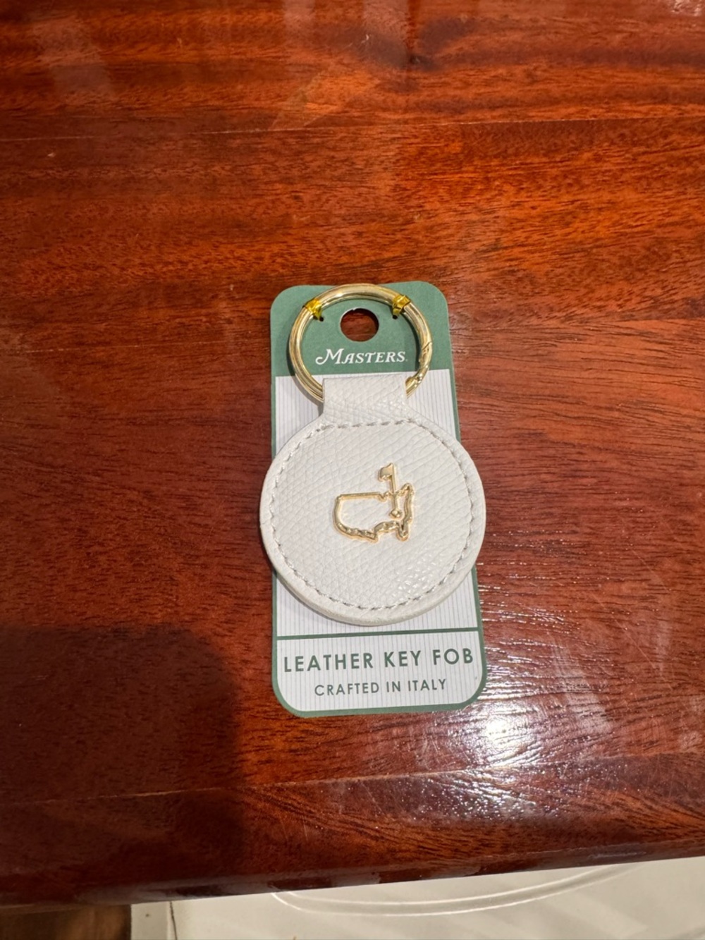 Masters White Leather Round Key Fob with Gold Emblem